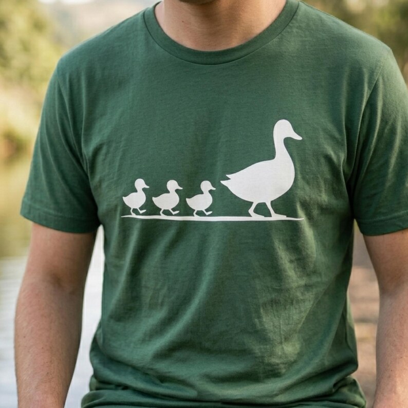 Minimalist animal graphic tee inspired by motherhood and nature aesthetics with duck family artwork.