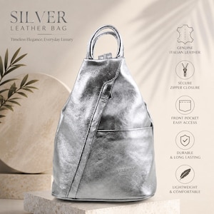 May include: A metallic silver leather backpack featuring a top handle, a diagonal front zipper closure, and an open front pocket. The bag displays the text SILVER LEATHER BAG, Timeless Elegance, Everyday Luxury, and icons for Italian leather.