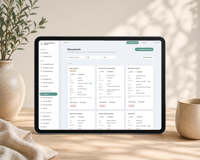 May include: A tablet displaying a digital family emergency binder interface with a sidebar menu and a main dashboard showing organized document cards for passports, insurance, licenses, birth certificates, and directives with edit and review options.
