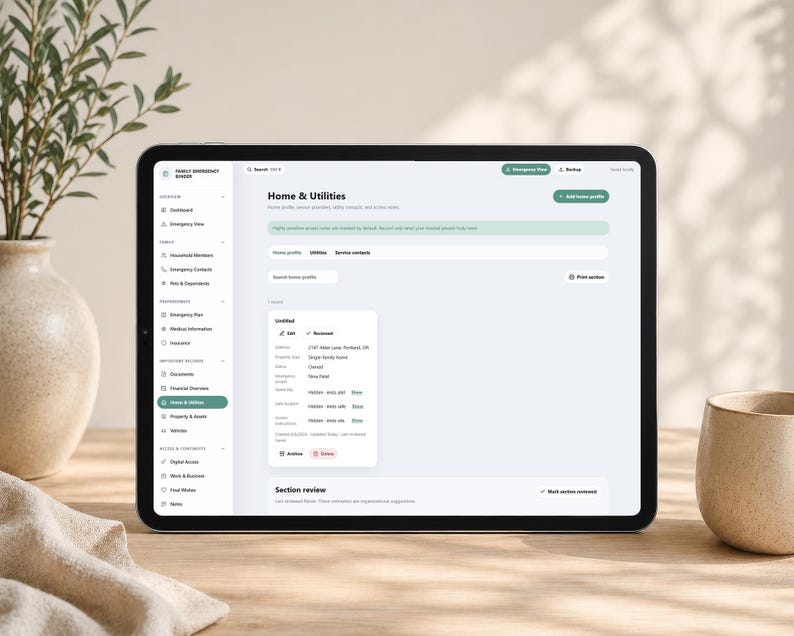 May include: A tablet displaying a digital interface titled Family Emergency Binder with a sidebar menu and a Home & Utilities section. The screen shows fields for property details, service contacts, and utility information with a white background.