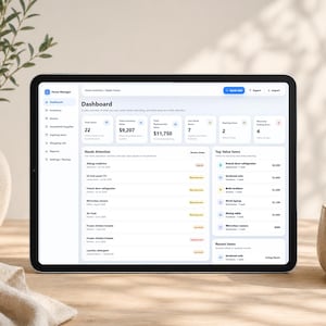 May include: A tablet displaying the Home Manager dashboard interface, featuring a navigation sidebar, inventory summary cards, a Needs Attention list, and a Top Value Items section. The screen shows data for Home Inventory, Maple House, with various household items listed.
