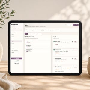 May include: A digital tablet displays an event planner interface with task management features. The screen shows event details, task lists, and progress tracking. The tablet is on a wooden surface, next to a vase with greenery and a ceramic mug.