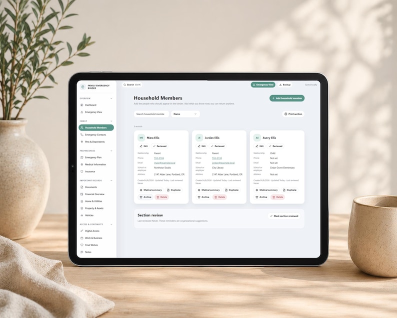 May include: A tablet displaying a digital interface titled Family Emergency Binder with a Household Members section. The screen shows three profile cards for Mara, Jordan, and Avery Ellis, including fields for phone, email, and school or employer details.