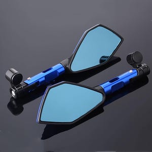 May include: A pair of motorcycle mirrors with a blue tint. The mirrors have a black frame and a blue stem. The mirrors are angled and have a sleek, modern design. The background is a dark gray.