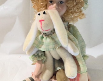 Porcelain Doll Holding Rabbit