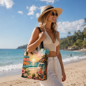 May include: A beach-themed tote bag featuring a vibrant sunset scene with a vintage van, surfboards, and tropical flowers. The bag has text that reads "Beach, Relax, Unwind, Enjoy". The bag is carried by a person on a sandy beach.