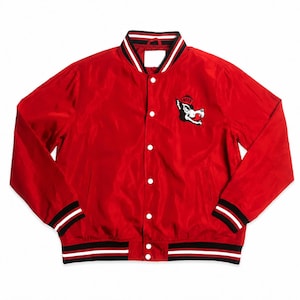 May include: Red satin jacket with a snap-button closure, featuring a black, white, and red striped collar, cuffs, and hem. A wolf logo patch is on the left chest. The jacket has a classic varsity style.