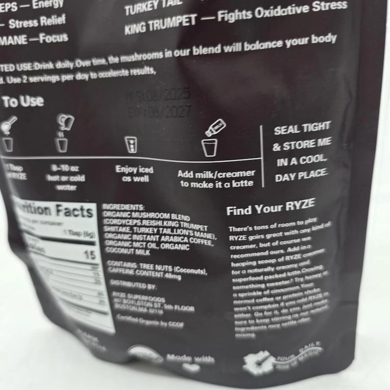 May include: Black package of RYZE mushroom blend coffee. The package includes instructions for use, nutritional information, and a list of ingredients. The text on the package includes "Stress Relief" and "Energy".