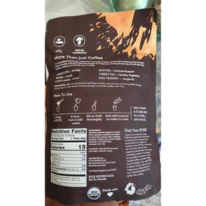 May include: A brown bag of RYZE mushroom coffee with text and graphics. The bag includes instructions, nutrition facts, and a list of ingredients. The product is USDA organic and contains 2000 mg of mushrooms.