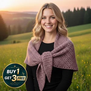 May include: A woman wearing a mauve crocheted shawl tied in front. The shawl is draped over a black top. The background is a green field and a sunset. A promotional graphic with the text "BUY 1 GET 3 FREE" is in the lower left corner.