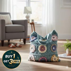 May include: A handmade, teal crochet tote bag with floral squares in shades of pink, purple, and cream. The bag has sturdy handles and a spacious interior, perfect for carrying essentials. The bag is sitting on a wooden floor.