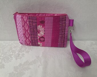 Sac/poignet rose matelassé zippé