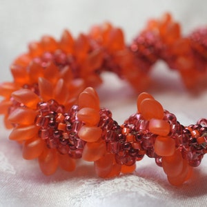 Orange tones spiral peyote beaded bracelet