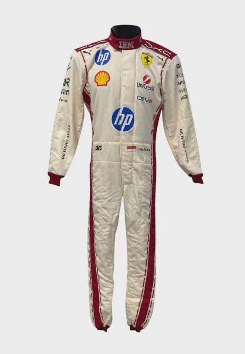 May include: A white and red racing suit featuring various sponsor logos including HP, Shell, UniCredit, and Ceva. The suit displays the number 16, the name Charles, a small flag, and Richard Mille branding on the sleeves with a high collar design.