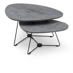 May include: A set of two nesting coffee tables featuring irregular, pebble-shaped tops with a dark gray, textured stone-like finish. The tables are supported by thin, black metal wire frames that connect at circular base points on the floor.