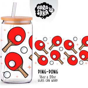 May include: A clear glass can with a bamboo lid and straw, decorated with red ping-pong paddles and white balls. The design includes the text "PING-PONG 16oz & 20oz GLASS CAN WRAP" and a black and white sheep logo.