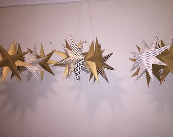 Gold or silver paper hanging stars