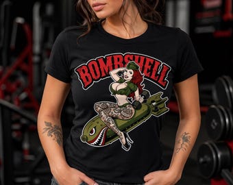 BOMBSHELL shirt sizes S-3xl. Bombshell with tat2 machine or 25lbs dumbbell.  50/50 Gildan shirt. Message me for what design you want. Thanks