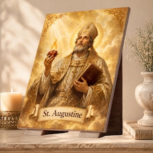 May include: A rectangular plaque featuring a golden-toned illustration of Saint Augustine wearing a mitre and ornate vestments, holding a flaming heart and a book. The text St. Augustine is printed on a scroll banner at the bottom of the image.