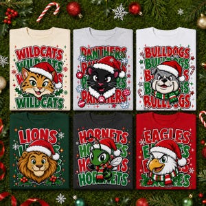 May include: Six crewneck sweatshirts arranged in two rows. Each shirt features a different animal mascot wearing a Santa hat and scarf, with team names like Wildcats, Panthers, Bulldogs, Lions, Hornets, and Eagles printed in festive holiday colors.