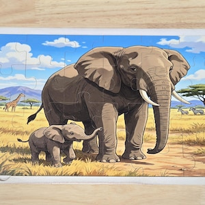 May include: A rectangular jigsaw puzzle featuring a cartoon illustration of a large adult elephant and a small calf walking through a grassy savanna. The background shows a blue sky with white clouds, distant mountains, a giraffe, and zebras.