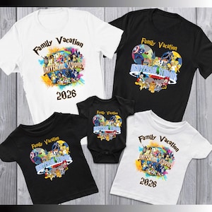 May include: Family vacation t-shirts and a onesie in black and white. Each shirt features the text "Family Vacation" and "Universal Studios 2026" with colorful graphics of cartoon characters.