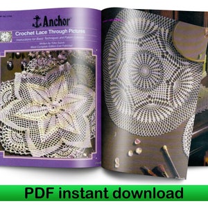 Puede incluir: Libro abierto con una cubierta morada que muestra patrones de encaje de ganchillo. El título del libro es "Anchor Crochet Lace Through Pictures".