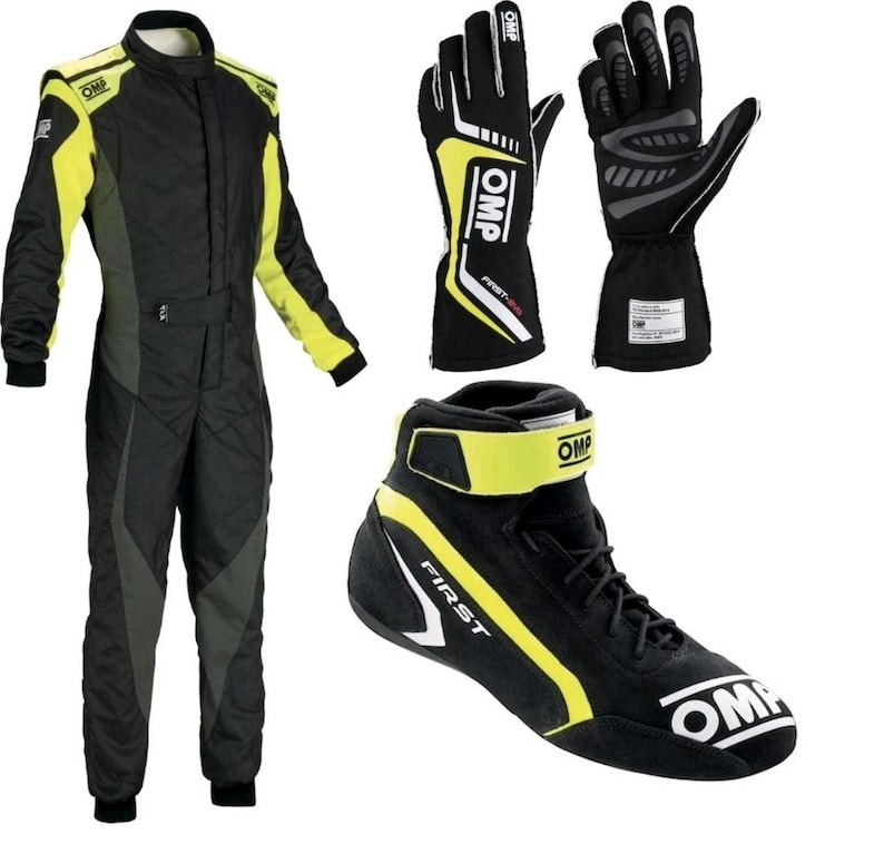 May include: A black and neon yellow OMP racing suit, a pair of black and neon yellow OMP racing gloves with white accents, and a single black and neon yellow OMP racing shoe with a high-top design, a hook-and-loop strap, and lace-up closure.
