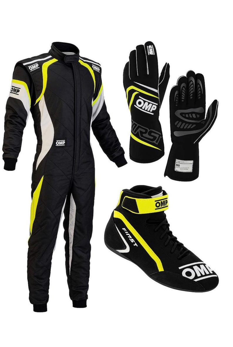 May include: A black racing suit with yellow and white accents, featuring the OMP logo on the chest and shoulders. Included are a pair of black racing gloves with white OMP branding and a black racing shoe with yellow trim and the OMP logo.