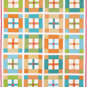 May include: A colorful quilt with a patchwork design featuring squares of different colors and patterns. The quilt is made up of 25 squares, each with a different design. The colors in the quilt include orange, green, blue, and white.