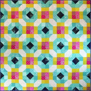 May include: A square quilt featuring a repeating geometric pattern of octagonal shapes. The design incorporates a vibrant color palette of turquoise, mustard yellow, hot pink, white, and dark navy blue, with various small-scale fabric prints.