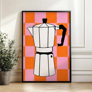May include: A framed wall art print featuring a white moka pot with a black handle and lid knob, centered against a vibrant background of alternating orange and pink squares. The illustration uses bold black outlines to define the coffee maker.
