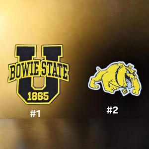 May include: Two embroidered patches. Patch #1 is a black and yellow U-shaped emblem featuring the text BOWIE STATE and 1865. Patch #2 is a yellow and black bulldog mascot figure with a white outline, depicted in a crouching, aggressive stance.