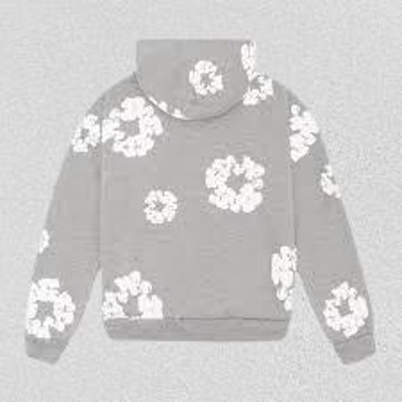 May include: A gray hoodie with a white floral pattern. The hoodie features a drawstring hood, long sleeves, and a ribbed hem and cuffs. The floral design is scattered across the front, back, and sleeves of the sweatshirt.