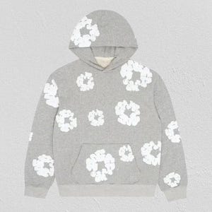 May include: A gray hoodie with a white floral pattern. The hoodie features a kangaroo pocket and a drawstring hood. The white floral design is repeated across the front, back, and sleeves of the sweatshirt. The hoodie is made of a soft, comfortable material.