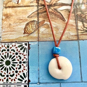 Pukashell Necklace & ceramic bead petrol
