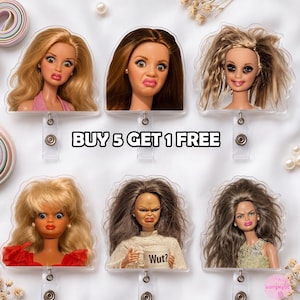 May include: Six acrylic badge reels featuring doll heads with various hairstyles and facial expressions, including one doll holding a mug with the text Wut?. The badge reels have a clear plastic construction and a metal clip mechanism. The text BUY 5 GET 1 FREE is centered.