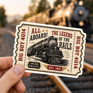May include: A rectangular sticker shaped like a vintage train ticket with a cream background. It features a black and white illustration of a Union Pacific Big Boy 4014 steam locomotive. Text includes ALL ABOARD!, THE LEGEND OF THE RAILS, BIG BOY 4014, and EST. 1941 in red and black lettering.