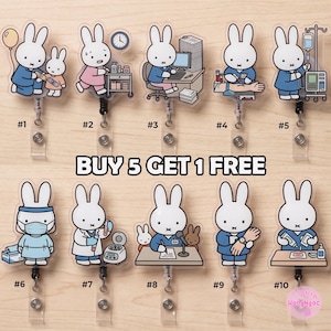 May include: Ten acrylic badge reels featuring white rabbit characters in various medical and office settings, including nursing, laboratory, and administrative tasks. Each reel has a retractable cord and a clear strap for identification cards.