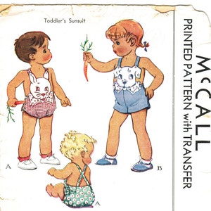 May include: Vintage McCall's sewing pattern for a toddler's sunsuit with a dog applique. The pattern is printed on paper and includes instructions for making the sunsuit. The pattern number is 1099 and the price is 35 cents.