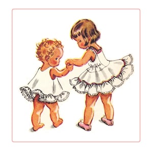 May include: Two young girls wearing white dresses with ruffled trim. The girls are holding hands and smiling. The girl on the left has curly brown hair and the girl on the right has straight brown hair.