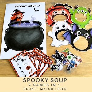 May include: A Spooky Soup game set featuring a large poster of a witch stirring a black cauldron, three character face cutouts of a witch, a green monster, and a ghost, plus small cards with numbers and illustrations of spiders, bones, pumpkins, and worms.
