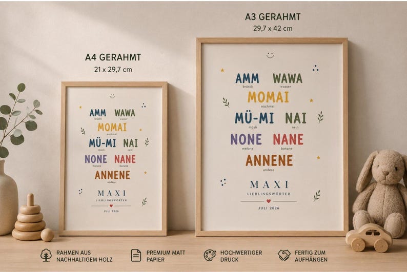 May include: Two framed posters in light wood frames, labeled A4 GERAHRMT 21 x 29.7 cm and A3 GERAHRMT 29.7 x 42 cm. The posters feature colorful text including AMM, WAWA, MOMAI, M&Uuml;-MI, NAI, NONE, NANE, ANNENE, MAXI, LIEBLINGSW&Ouml;RTER, and JULI 2024.