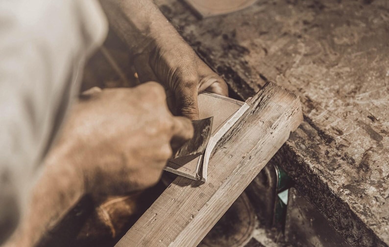 Back view of the heel and sole construction of a handmade leather shoe.