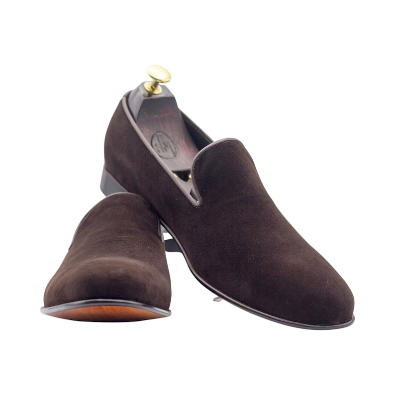 Luxury brown velvet slip-on shoes with a sophisticated leather-trimmed collar.