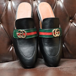Handcrafted men’s slip-on dress shoes in smooth-grain black leather.
