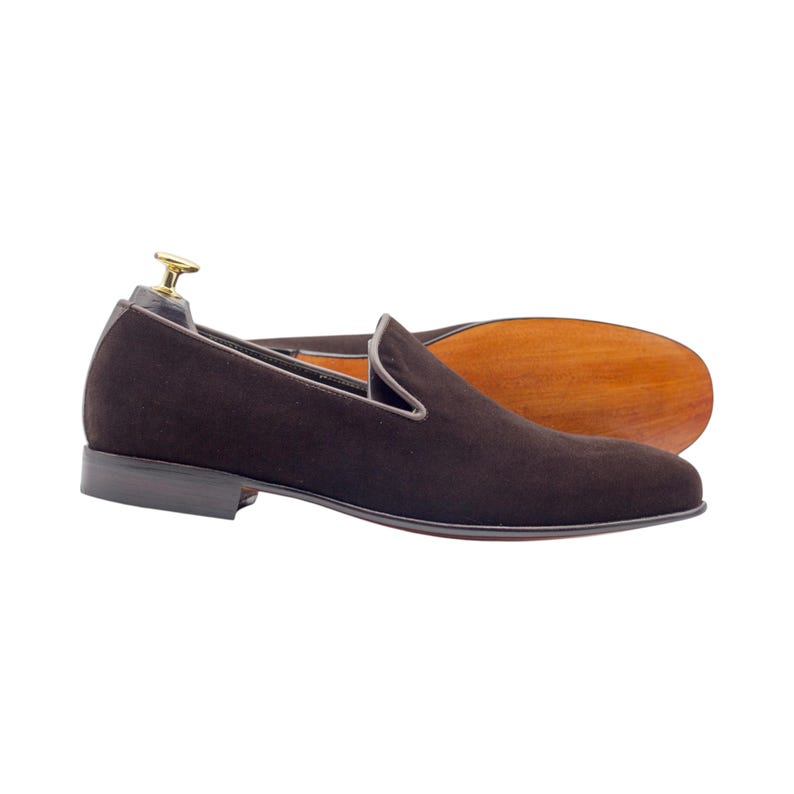 Stylish men’s slip-on shoes with a durable hand-finished black stacked heel.