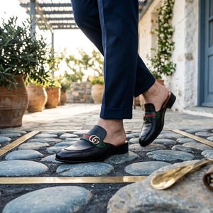 Men’s handmade black leather mules with a backless slip-on design.