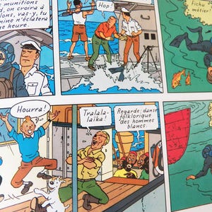 May include: A comic book page featuring multiple panels with illustrations of characters on a ship and underwater. The scenes depict a diver in a suit, people talking on a deck, a person jumping for joy, and a diver swimming near a red boat hull.