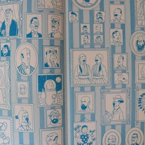 May include: A wallpaper pattern featuring a light blue and white vertical striped background covered in numerous framed illustrations of various characters in a blue ink line art style, including portraits, figures in hats, and a space-suited character.